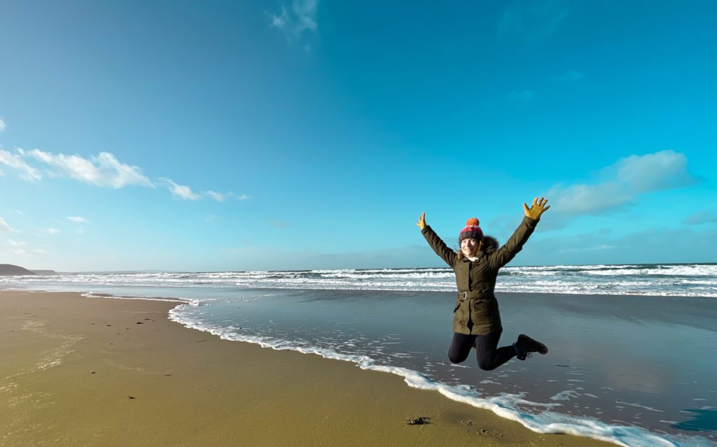 Lucy jumping on the beach