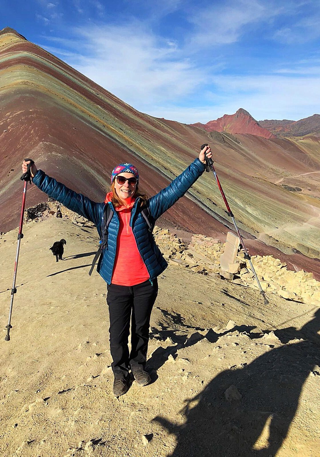 Nutritionist, Lucy celebrating reaching the top of Rainbow Mountain
